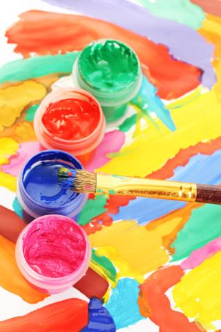 Colorful paint with paintbrush