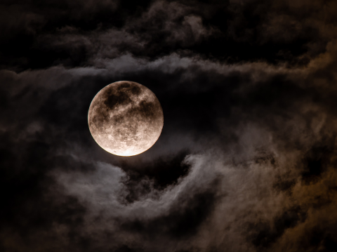 moon in dark clouds