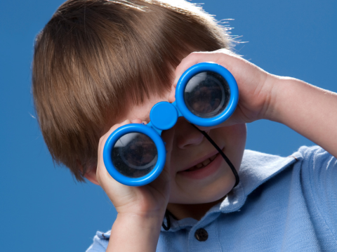 boy holding binoculars