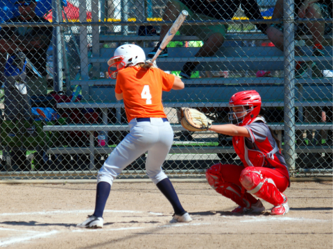 woman swinging bat