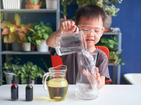 kid doing science experiment